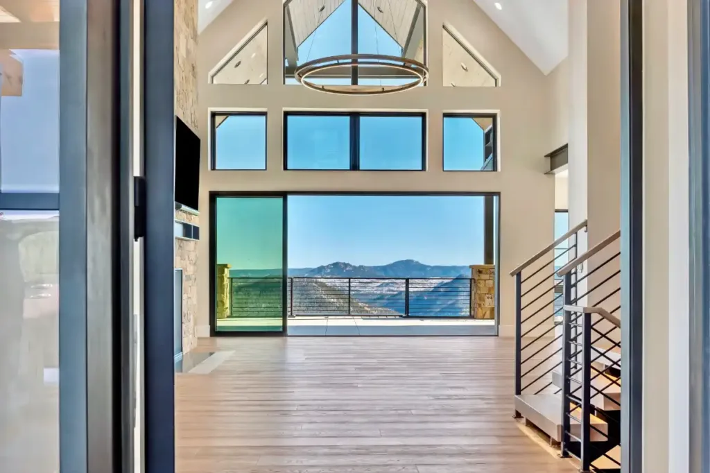 Pine mountaintop retreat custom home view from living room - Custom Home Builder in Centennial, CO